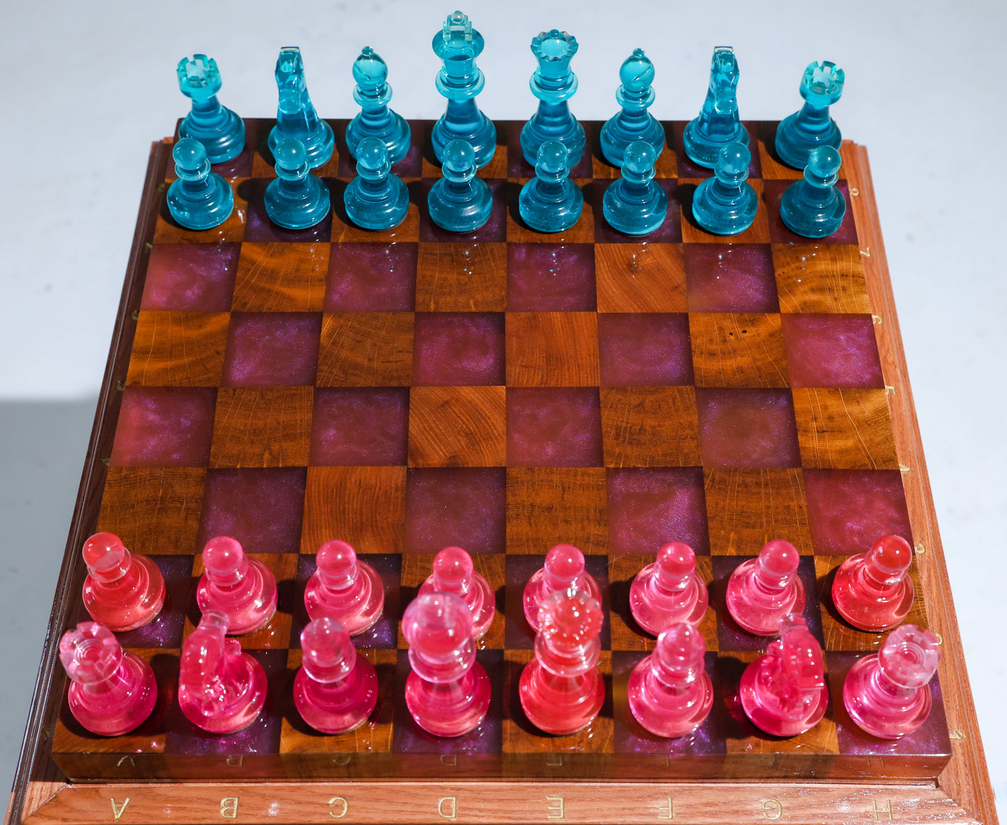 Granadas Rosé Royale Chess Set – close-up of the pink and white wood and epoxy resin pattern on the board
