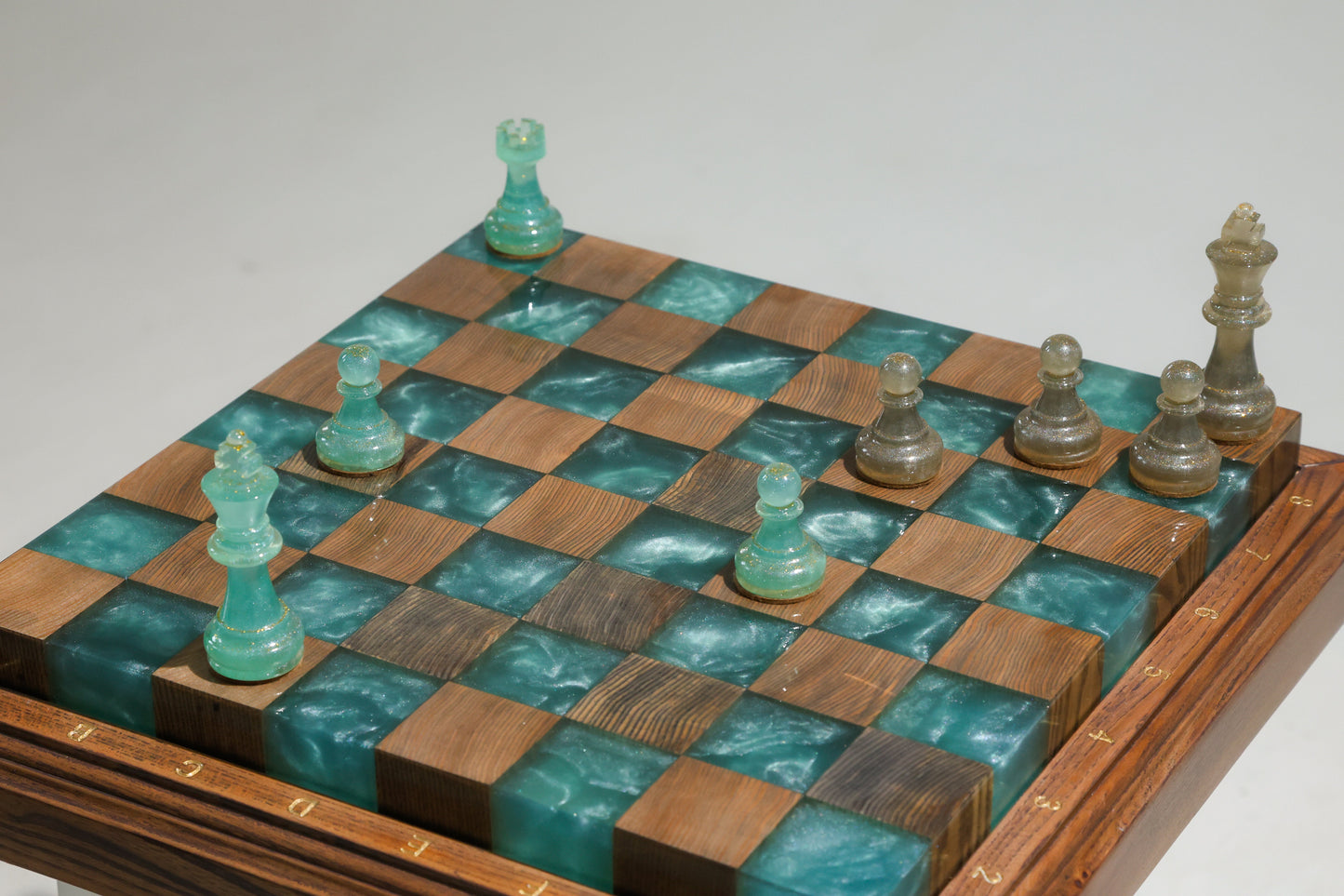 Granadas Luminous Azure Chess Set – close-up of the deep blue wood and epoxy resin pattern on the board