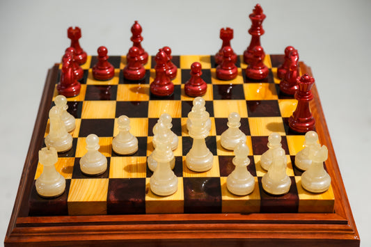 Granadas Crimson Pearl Chess Set – close-up of the pearl white and deep red wood and epoxy resin pattern on the board