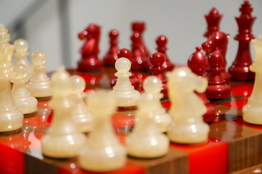 Granadas Crimson Glow Chess Set – close-up of the red and white wood and epoxy resin pattern on the board